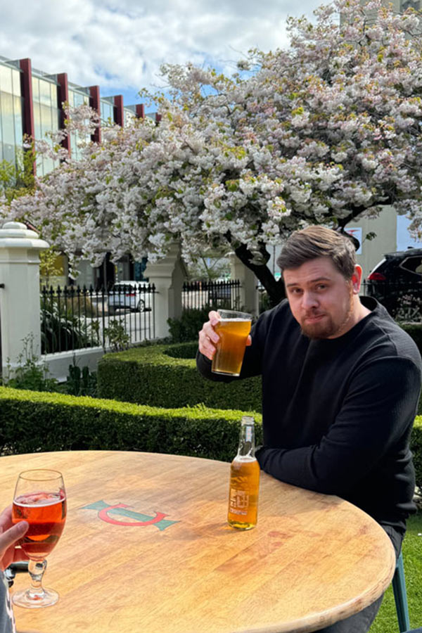 Gus from Back9 Creative cheers to the beer garden in spring at the Invercargill Club